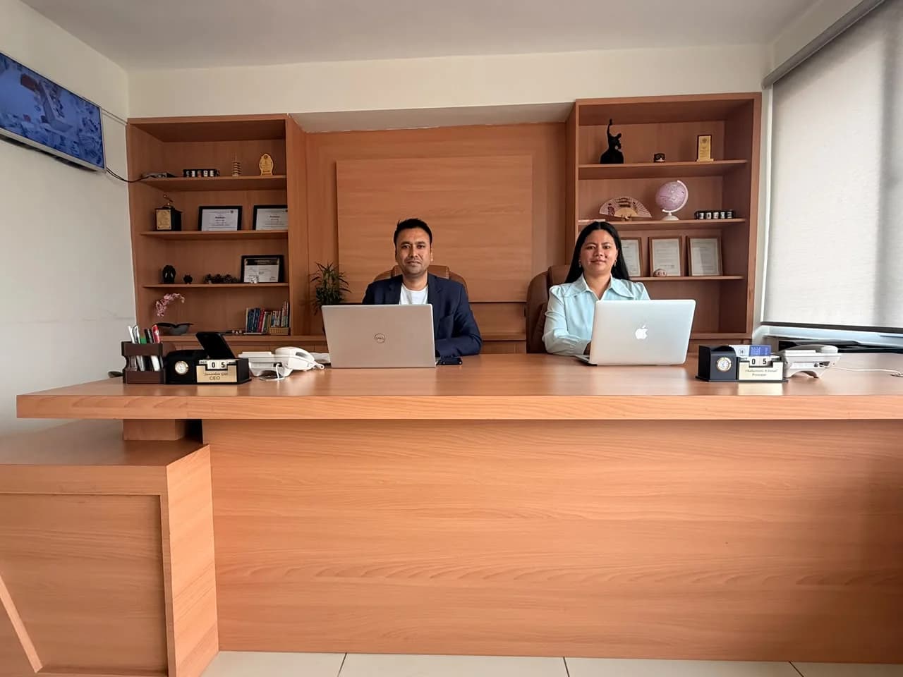 The CEO and the principal at their desk in the Akshara office
